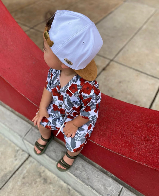 Toddler in Stylish Tropical Leaves and Red Hibiscus Flower Button-Down Hawaiian Shirt and Tropical Shorts - Perfect for tropical 1st birthdays, tropical kids birthday party, kids summer wedding guest outfit, tropical baby shower gift.